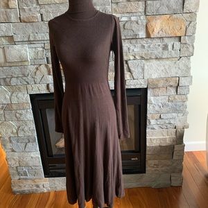 Brown turtleneck sweater dress. Fitted with slightly loose bottom